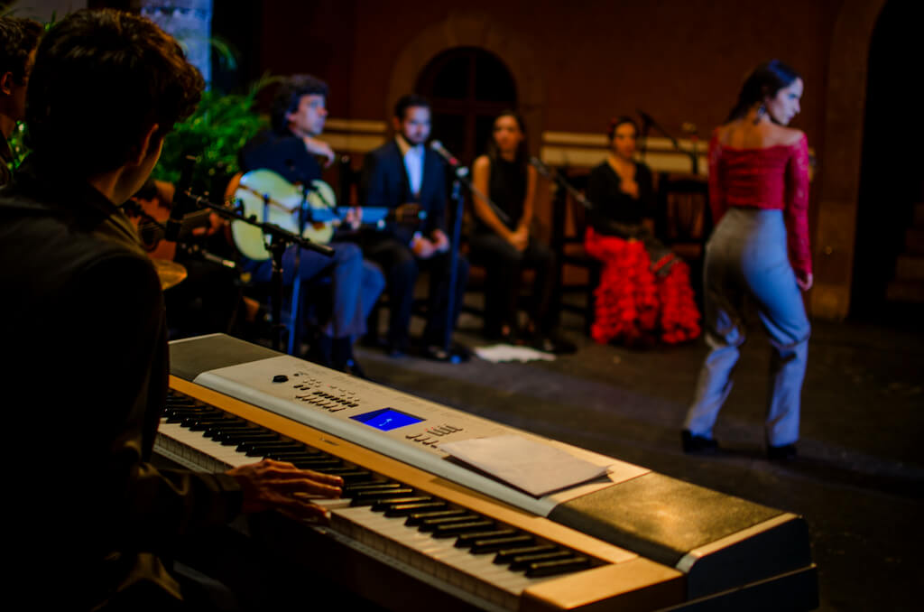 Emmanuel playing keyboard in Flamenco concert